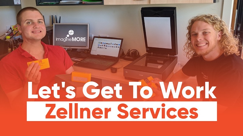 Two young men holding slides in front of a desk covered in computers and other equipment. The title is "Let's get to work: Zellner Services".