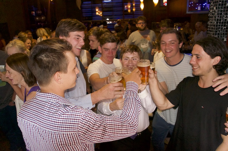 Sean and his friends drinking beer at the pub